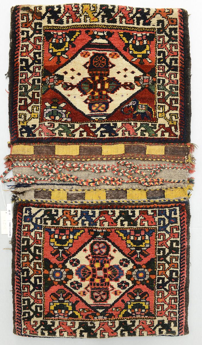 Double Saddle Bag (Khorjin), Wool (warp, weft, and pile); symmetrically knotted pile and slit tapestry (kilim) closure (front); weft-faced plain weave with twined and braided loop closures (back)