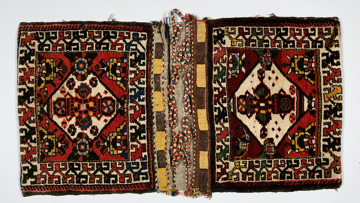 Double Saddle Bag (Khorjin), Wool (warp, weft, and pile); symmetrically knotted pile and slit tapestry (kilim) closure (front); weft-faced plain weave with twined and braided loop closures (back) 