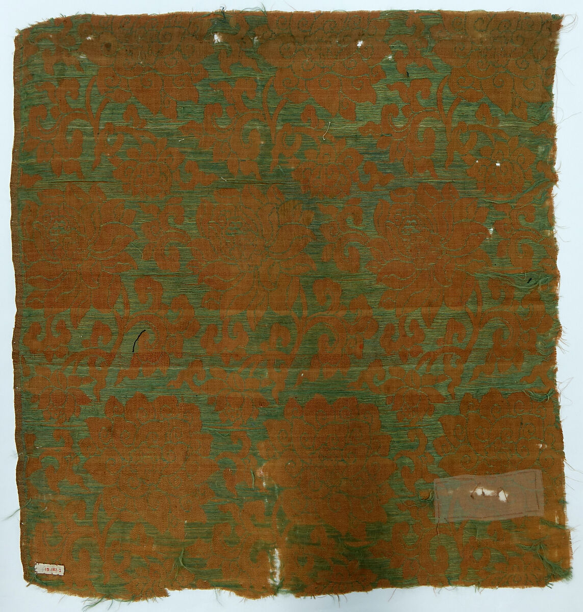 Textile fragment with floral scrolls, Silk satin with supplementary weft pattern, China