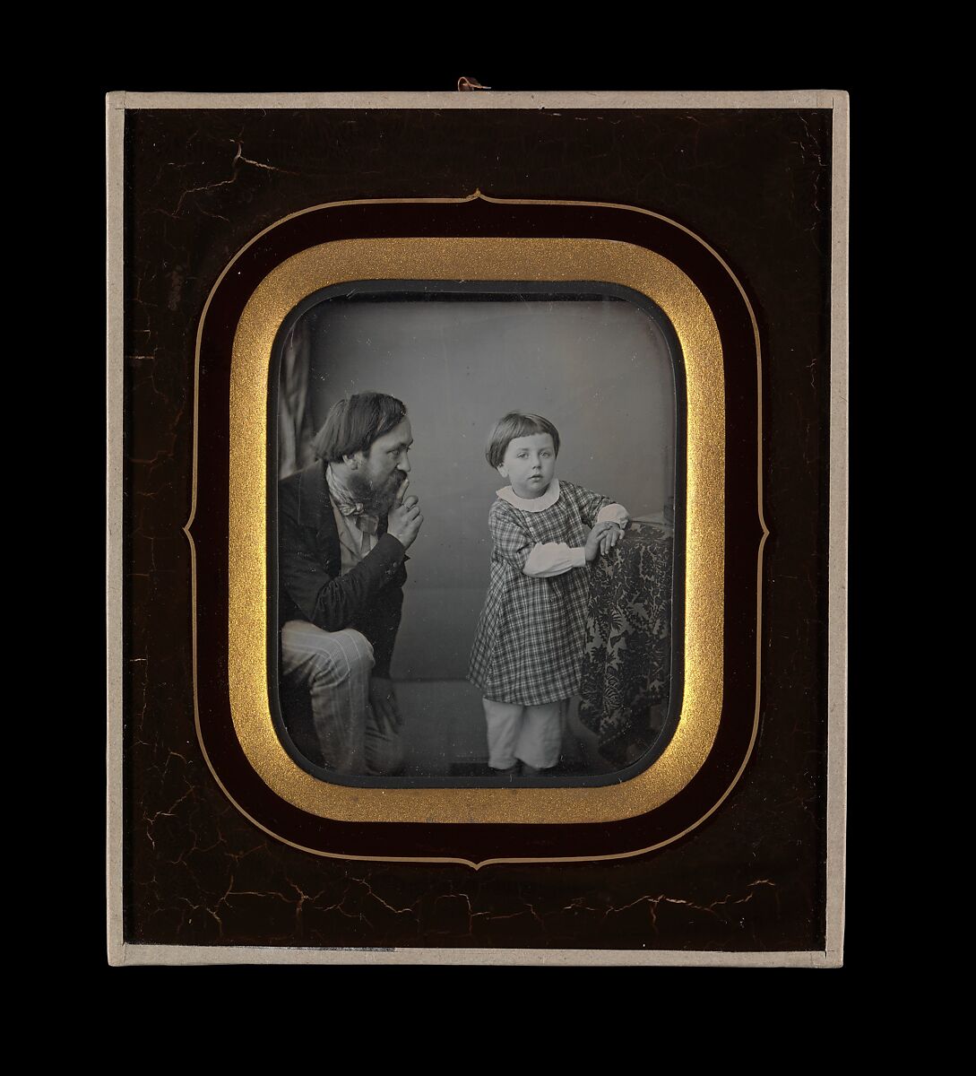 [Man Calming a Young Boy Posing before the Camera], Unknown (French), Daguerreotype 