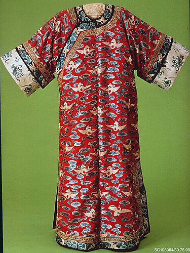 Woman’s robe decorated with cranes amid clouds