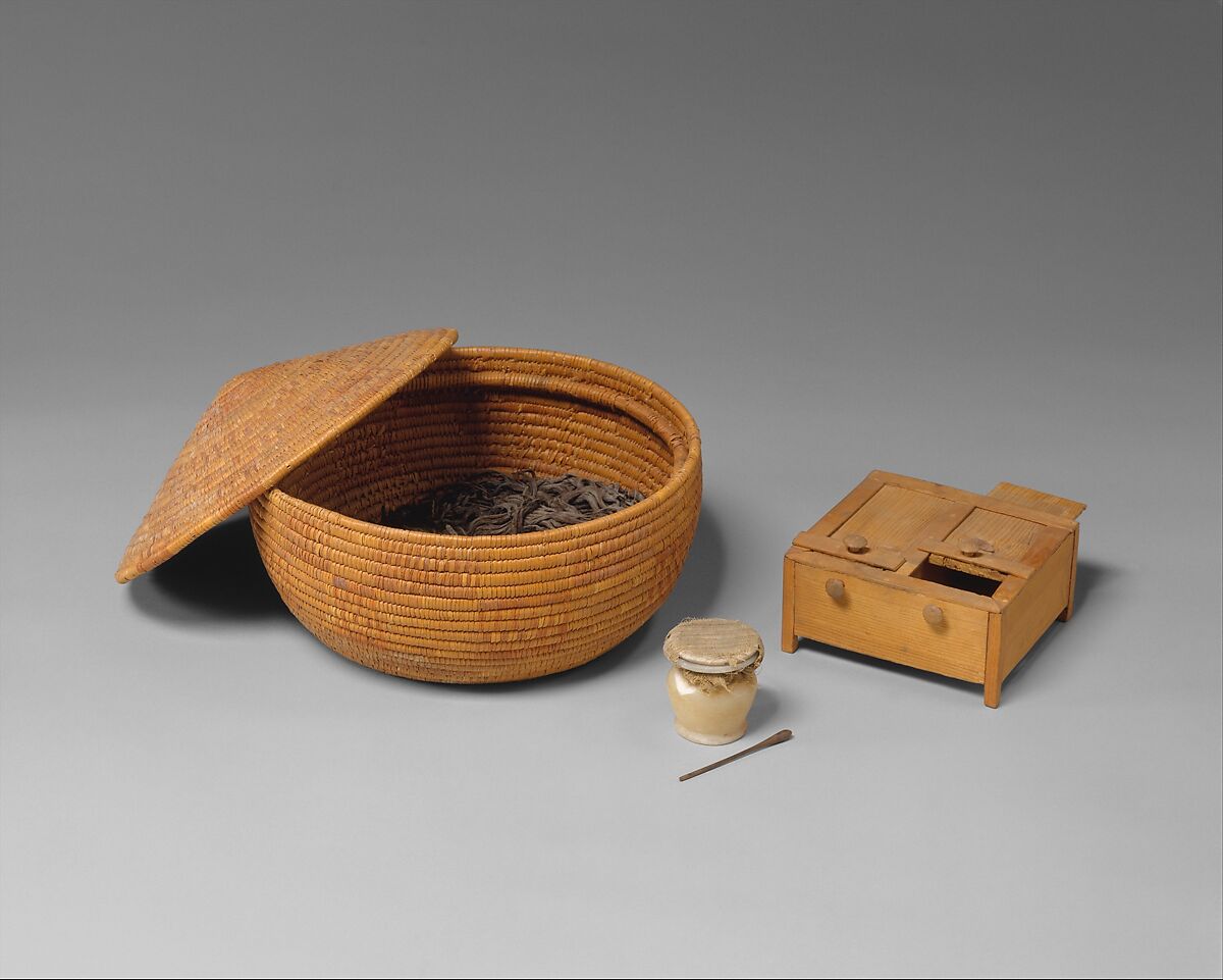 Basket and toilet articles, Halfa grass and linen cord; travertine (Egyptian alabaster); linen, linen cord, ebony; boxwood and cypress 