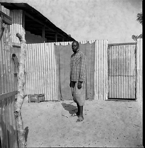 Man Standing in a Courtyard