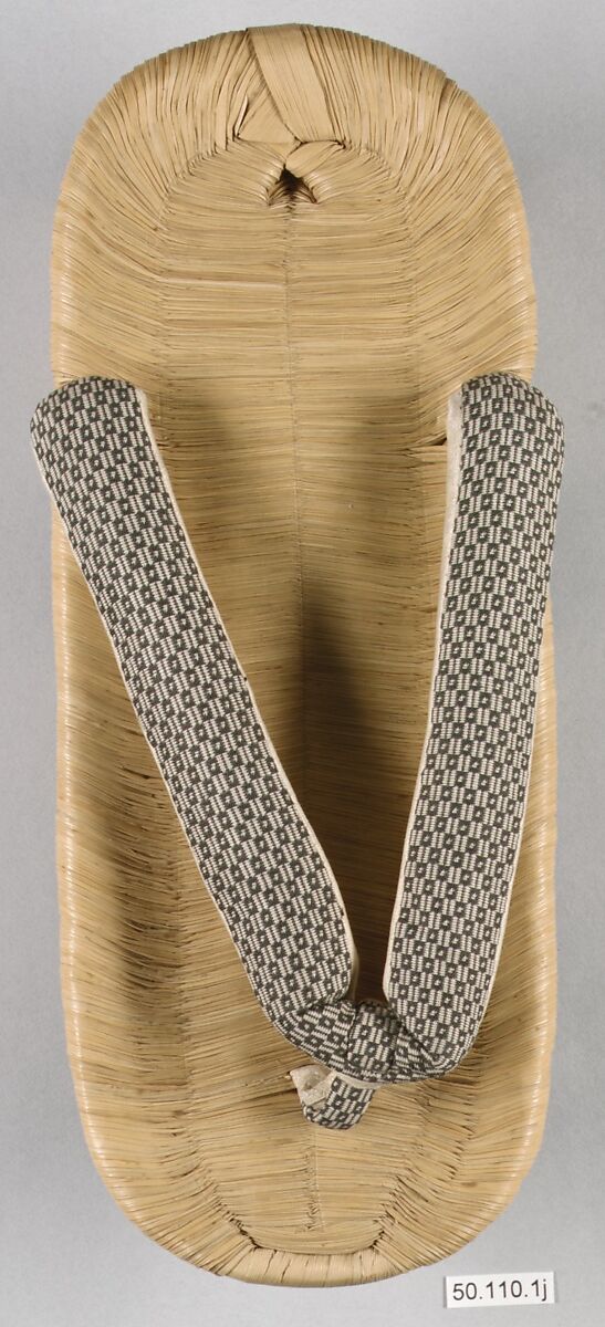 Costume of a Japanese Gentleman, (a) Silk,metalic thread / Plain weave
(b) Silk / Plain weave
(c) Silk / Plain weave
(d) Cotton; Silk / Plain weave
(e) Silk / Plain weave
(f) Silk / Braided
(g) Straw, leather / Woven
(h) Straw, leather / Woven
(i) Rush; leather; silk; wood / Woven
(j) Rush; leather; silk; wood / Woven
(k) Cotton / Knit
(l) Cotton / Knit, Japan