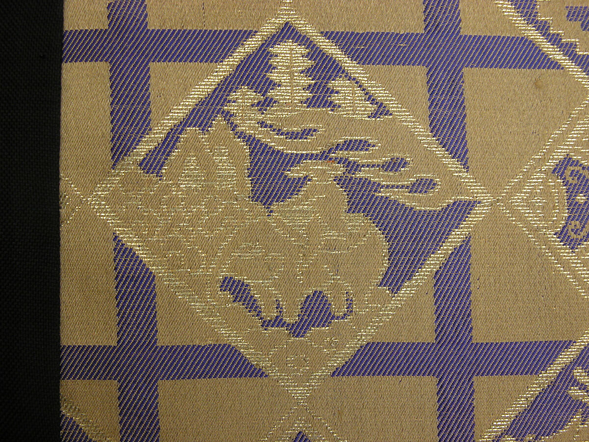 Costume of a Japanese Gentleman, (a) Silk,metalic thread / Plain weave
(b) Silk / Plain weave
(c) Silk / Plain weave
(d) Cotton; Silk / Plain weave
(e) Silk / Plain weave
(f) Silk / Braided
(g) Straw, leather / Woven
(h) Straw, leather / Woven
(i) Rush; leather; silk; wood / Woven
(j) Rush; leather; silk; wood / Woven
(k) Cotton / Knit
(l) Cotton / Knit, Japan