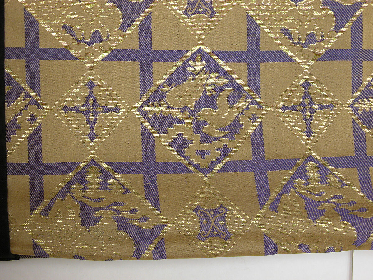 Costume of a Japanese Gentleman, (a) Silk,metalic thread / Plain weave
(b) Silk / Plain weave
(c) Silk / Plain weave
(d) Cotton; Silk / Plain weave
(e) Silk / Plain weave
(f) Silk / Braided
(g) Straw, leather / Woven
(h) Straw, leather / Woven
(i) Rush; leather; silk; wood / Woven
(j) Rush; leather; silk; wood / Woven
(k) Cotton / Knit
(l) Cotton / Knit, Japan