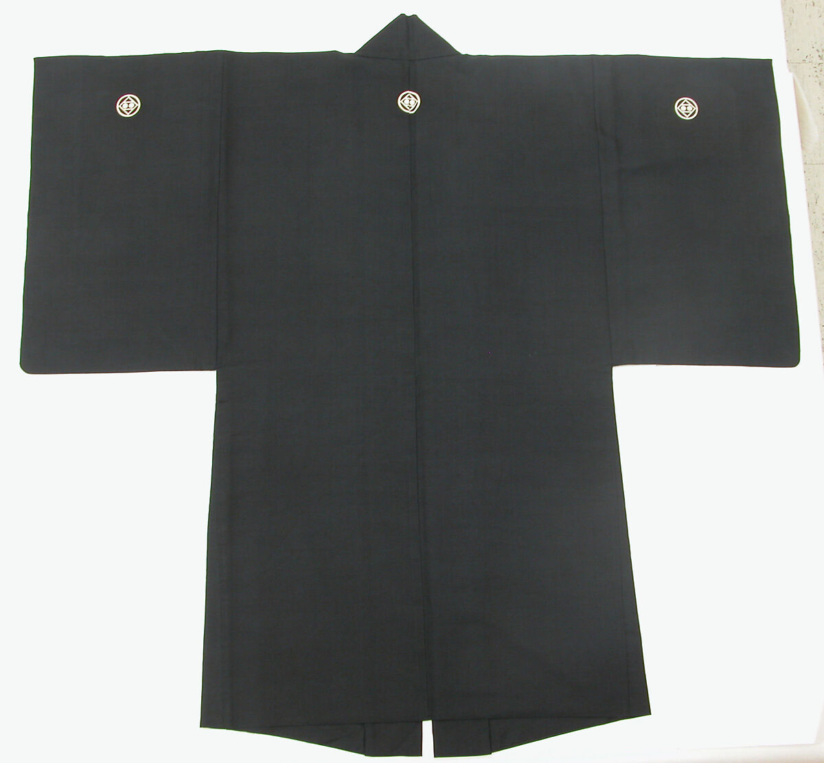 Costume of a Japanese Gentleman, (a) Silk,metalic thread / Plain weave
(b) Silk / Plain weave
(c) Silk / Plain weave
(d) Cotton; Silk / Plain weave
(e) Silk / Plain weave
(f) Silk / Braided
(g) Straw, leather / Woven
(h) Straw, leather / Woven
(i) Rush; leather; silk; wood / Woven
(j) Rush; leather; silk; wood / Woven
(k) Cotton / Knit
(l) Cotton / Knit, Japan