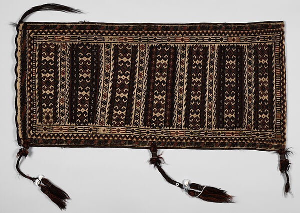 Saddle Bag, Loom-woven flat weave cloth in wool folded and joined at the sides with overcast stitches faces of different pattern; decorated with braids 