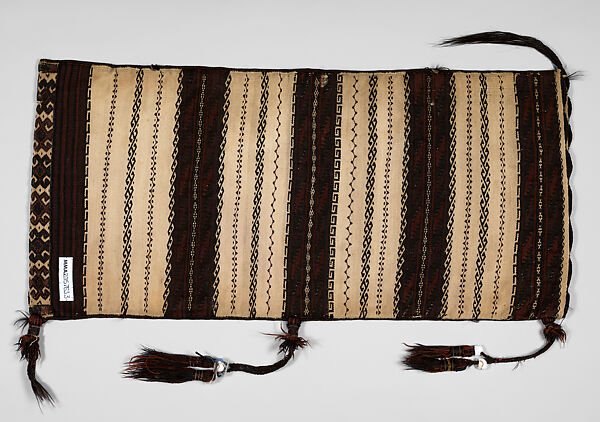 Saddle Bag, Loom-woven flat weave cloth in wool folded and joined at the sides with overcast stitches faces of different pattern; decorated with braids