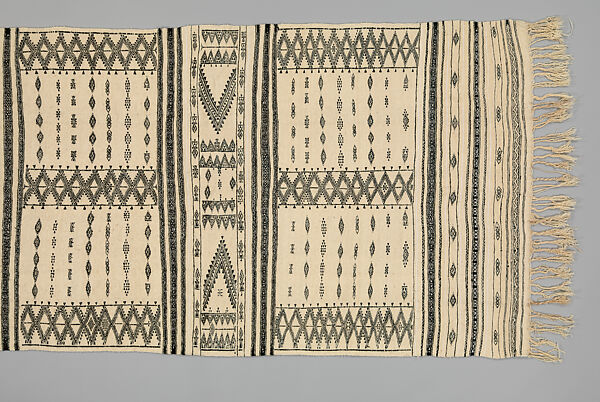 Bakhnug Shawl, Loom-woven plain weave cloth in wool with fine geometric pattern brocaded possibly in cotton; finished with warp-twisted fringes