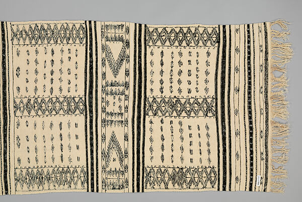 Bakhnug Shawl, Loom-woven plain weave cloth in wool with fine geometric pattern brocaded possibly in cotton; finished with warp-twisted fringes