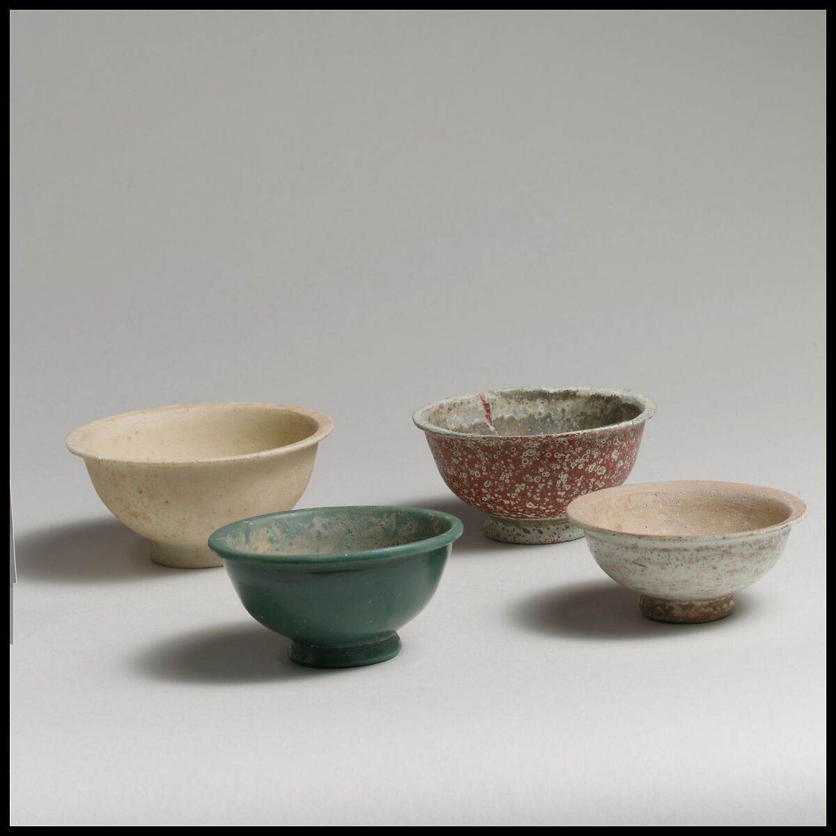 Four monochrome bowls, glass, Roman, Syrian 