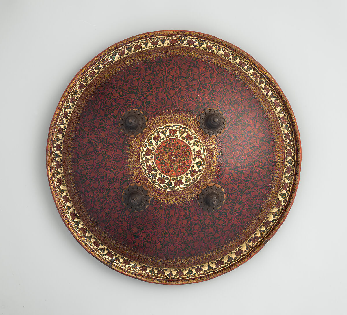 Shield (Dhál), Signed by Khooshal Dhunjee &amp; Sons (Indian, Ahmedabad, 19th century), Leather, brass, textile, pigment, Indian, Gujarat 
