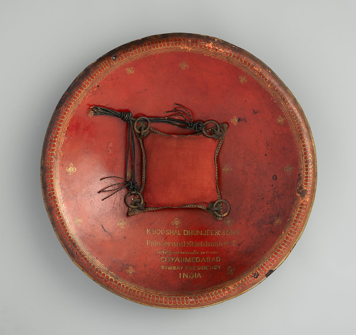 Shield (<i>Dhál</i>), Signed by Khooshal Dhunjee &amp; Sons (Indian, Ahmedabad, 19th century), Leather, brass, textile, pigment, iron, Indian, Gujarat