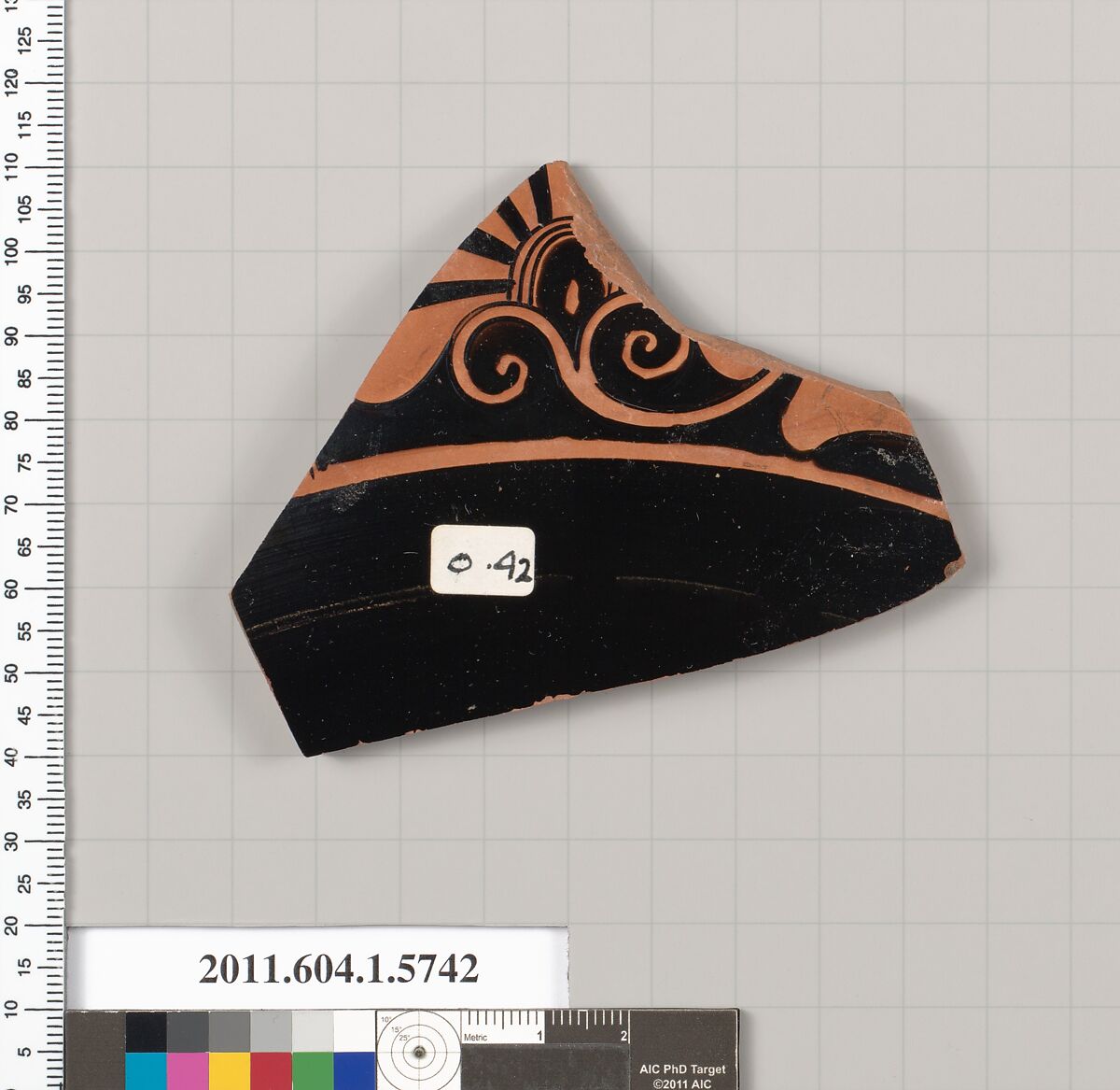 Terracotta fragment of a kylix: eye-cup  (drinking cup), Terracotta, Greek, Attic 