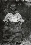 Woman outdoors – Ewe kente skirt, headtie and blouse, Alex Agbaglo Acolatse (Togolese, Kedzi 1880–1975 Lomé), Gelatin silver print
