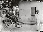 Two dapper young men in pull cart, Alex Agbaglo Acolatse (Togolese, Kedzi 1880–1975 Lomé), Gelatin silver print
