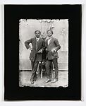 Two dapper young men leaning on a chair, Alex Agbaglo Acolatse (Togolese, Kedzi 1880–1975 Lomé), Gelatin silver print