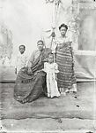 Family with two children, parents in Ewe kente cloth with painted backdrop, Alex Agbaglo Acolatse (Togolese, Kedzi 1880–1975 Lomé), Gelatin silver print