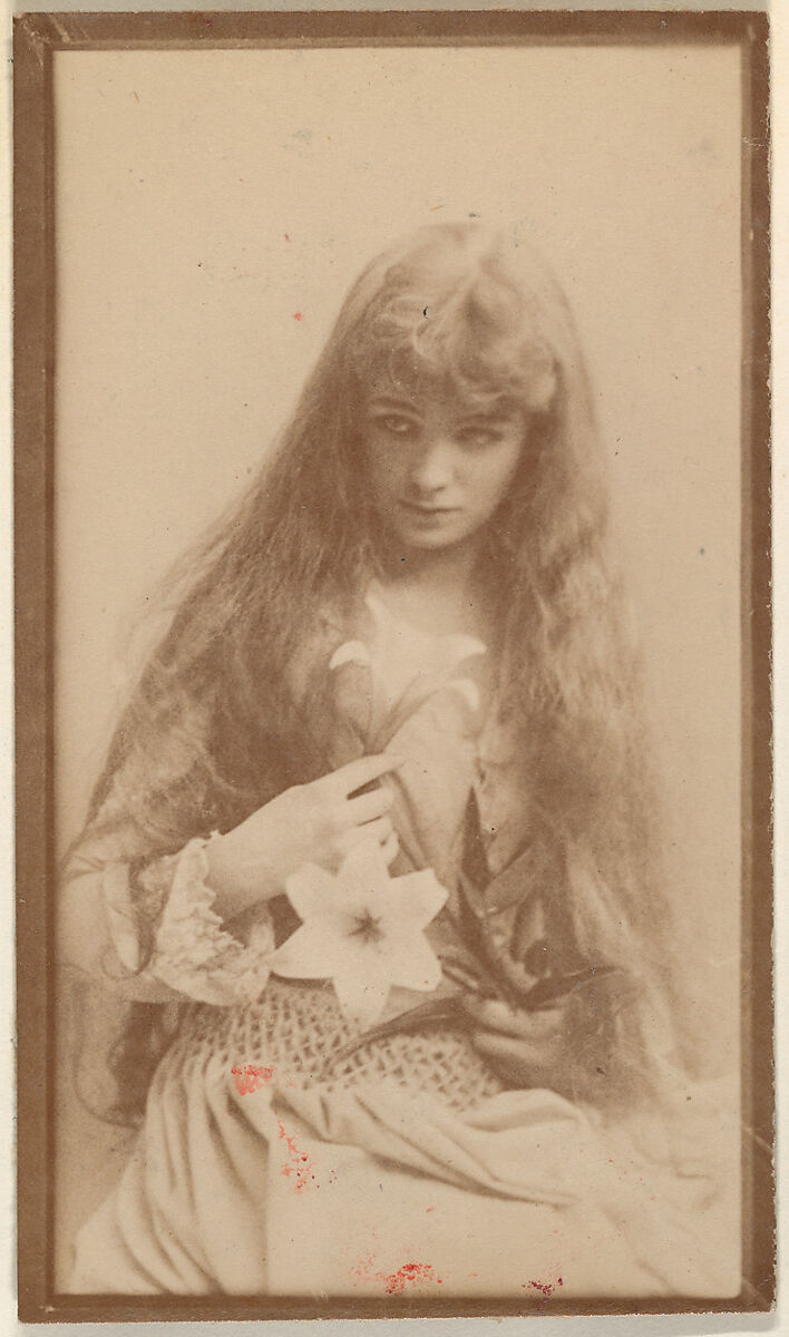 Actress with long hair seated with flower on lap, from the Actresses series (N668), Albumen photograph 
