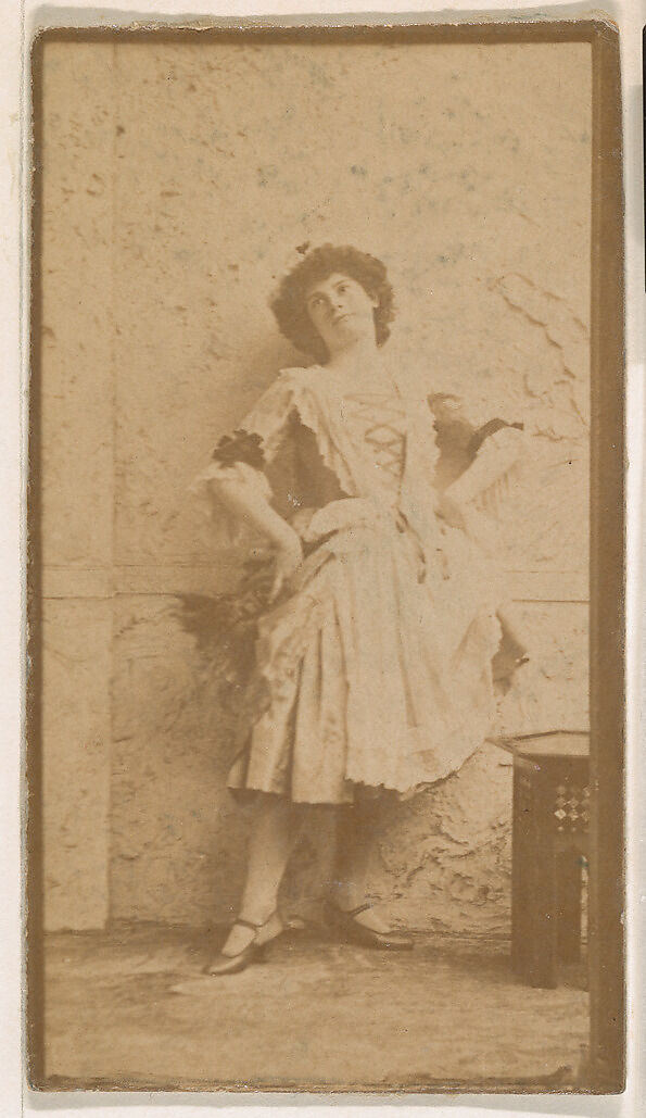Actress leaning against wall, from the Actresses series (N664) promoting Old Fashion Fine Cut Tobacco, Albumen photograph 