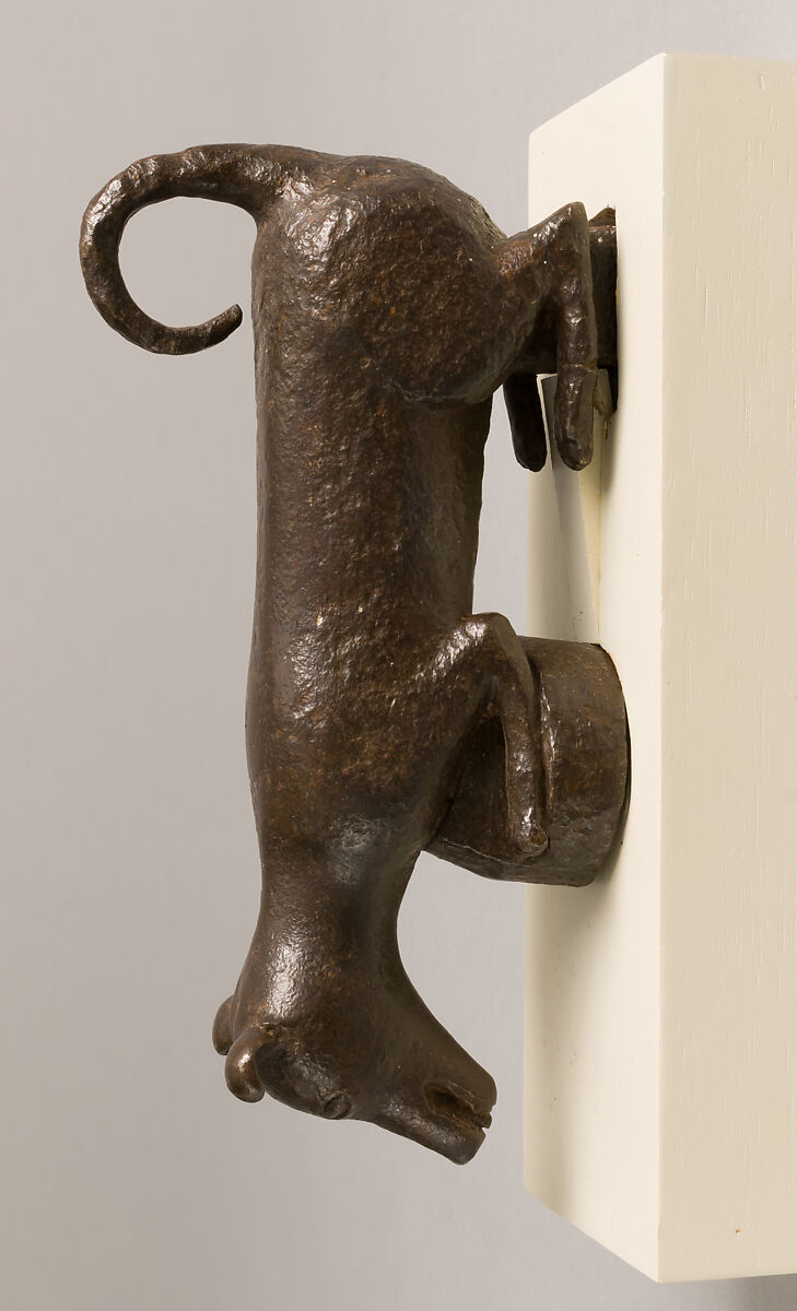 Door knocker in the shape of a small dog or puppy, Wrought iron, Spanish
