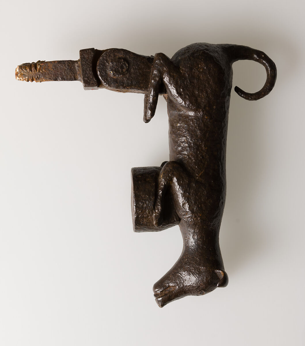 Door knocker in the shape of a small dog or puppy, Wrought iron, Spanish