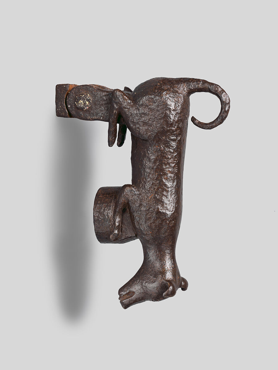 Door knocker in the shape of a small dog or puppy, Wrought iron, Spanish