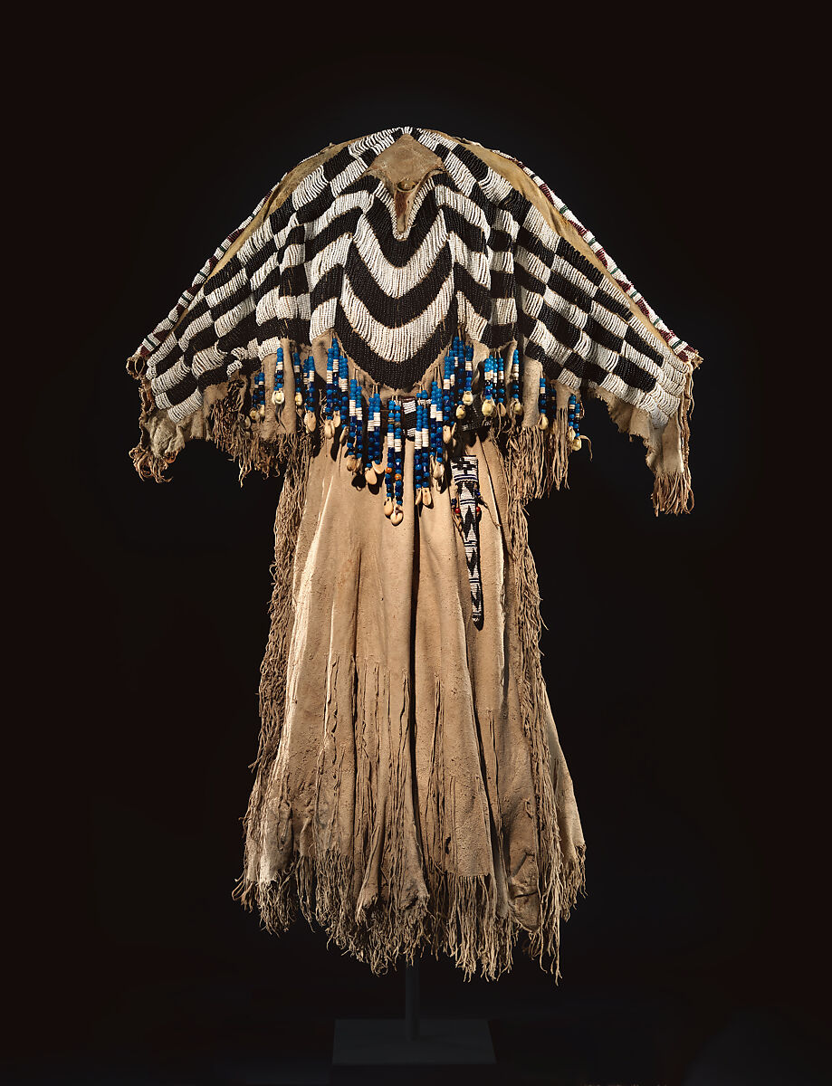 Dress and belt with awl case, Dress: tanned leather, glass beads, shell, bone, elk teeth, and brass thimbles
belt: commercial leather, glass beads, and metal studs
awl case: tanned leather, and glass beads, Wasco, Native American 