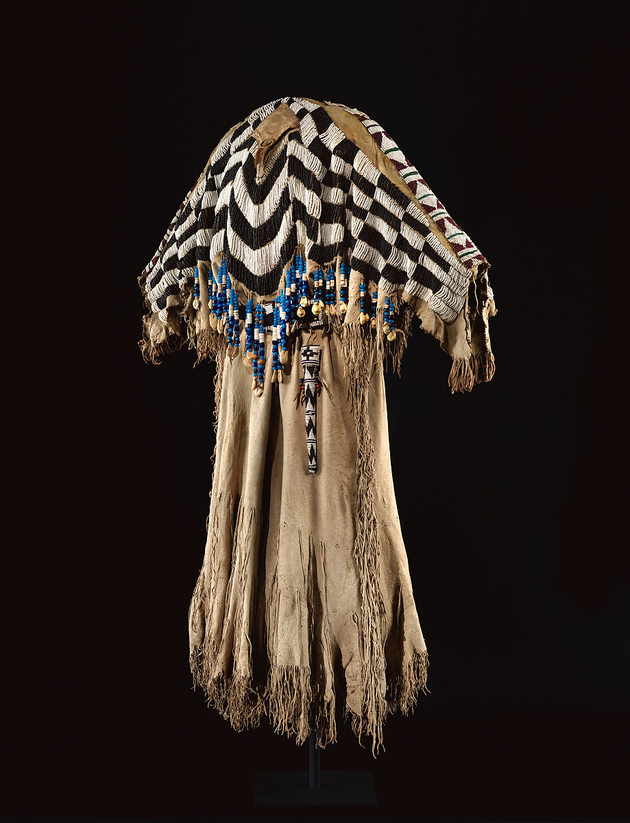 Dress and belt with awl case, Dress: tanned leather, glass beads, shell, bone, elk teeth, and brass thimbles
belt: commercial leather, glass beads, and metal studs
awl case: tanned leather, and glass beads, Wasco, Native American