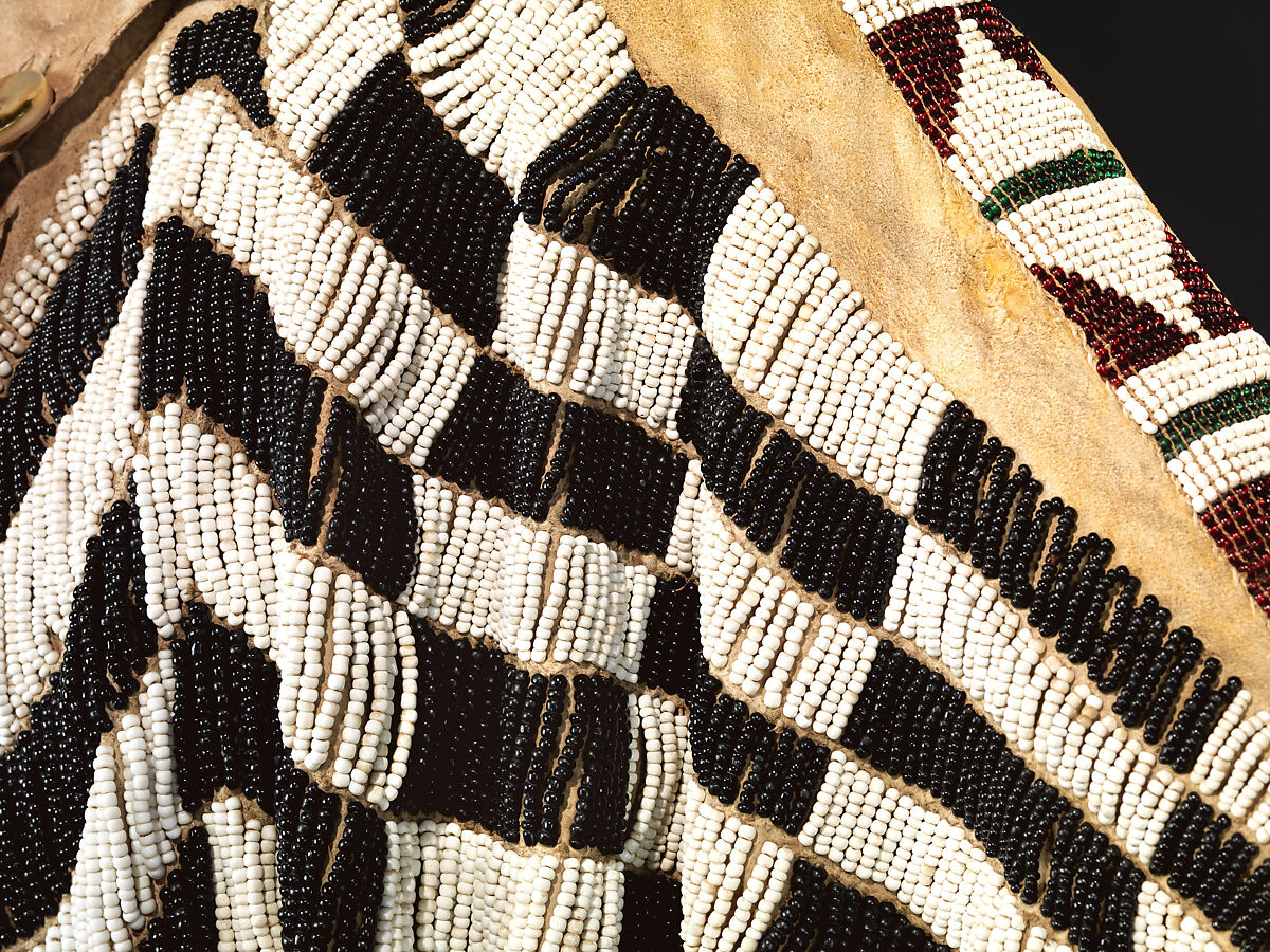 Dress and belt with awl case, Dress: tanned leather, glass beads, shell, bone, elk teeth, and brass thimbles
belt: commercial leather, glass beads, and metal studs
awl case: tanned leather, and glass beads, Wasco, Native American