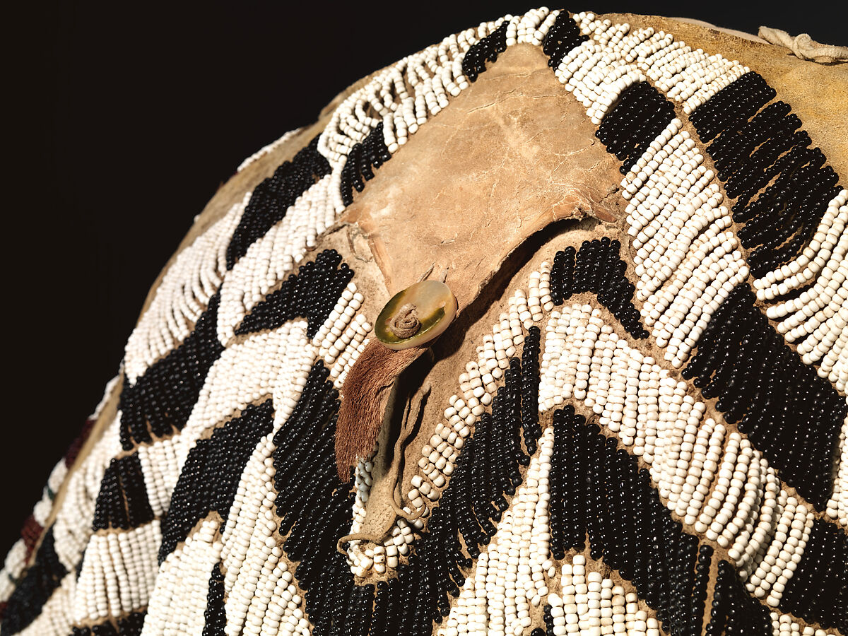 Dress and belt with awl case, Dress: tanned leather, glass beads, shell, bone, elk teeth, and brass thimbles
belt: commercial leather, glass beads, and metal studs
awl case: tanned leather, and glass beads, Wasco, Native American