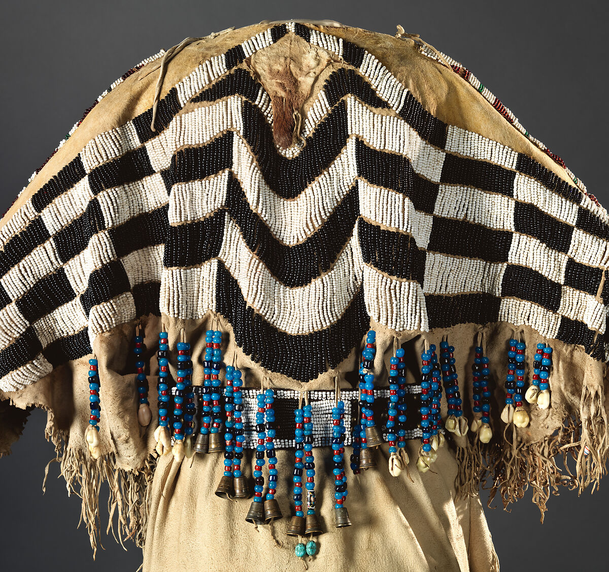 Dress and belt with awl case, Dress: tanned leather, glass beads, shell, bone, elk teeth, and brass thimbles
belt: commercial leather, glass beads, and metal studs
awl case: tanned leather, and glass beads, Wasco, Native American