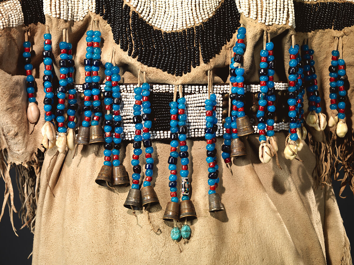 Dress and belt with awl case, Dress: tanned leather, glass beads, shell, bone, elk teeth, and brass thimbles
belt: commercial leather, glass beads, and metal studs
awl case: tanned leather, and glass beads, Wasco, Native American