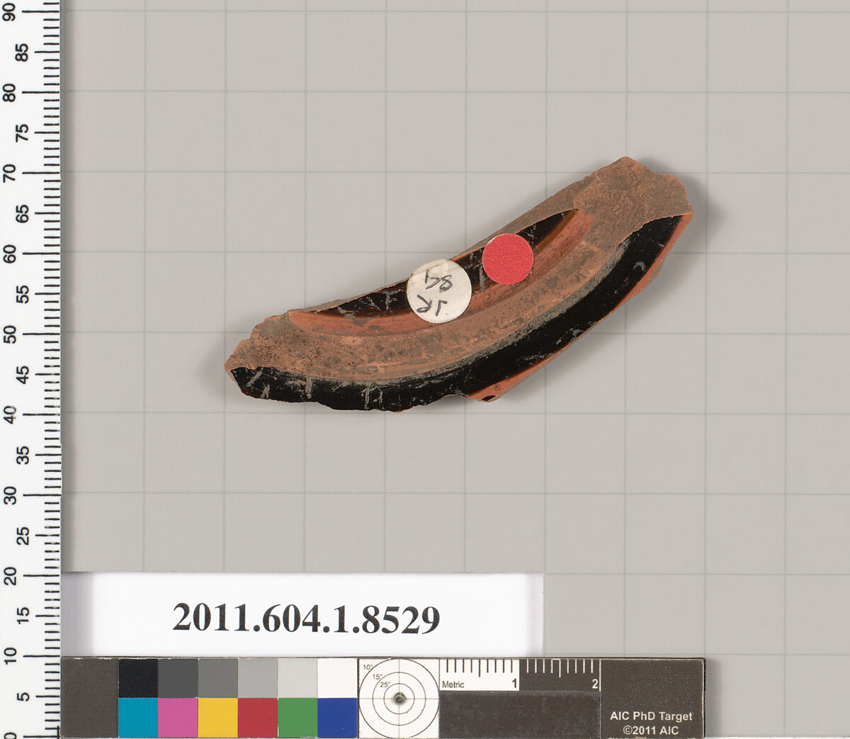 Terracotta fragment of a stemless kylix (drinking cup), Terracotta, Greek, Attic