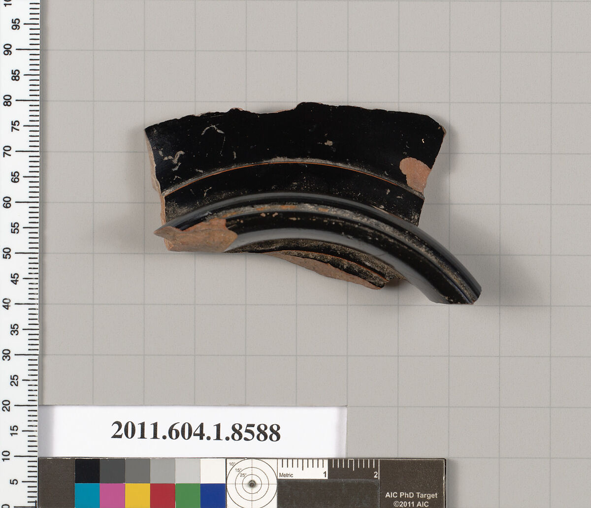 Terracotta fragment of a stemless kylix (drinking cup), Terracotta, Greek, Attic