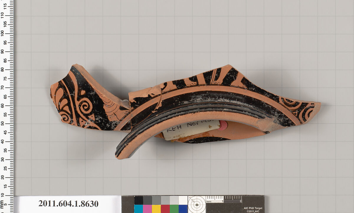 Terracotta fragment of a stemless kylix (drinking cup), Terracotta, Greek, Attic