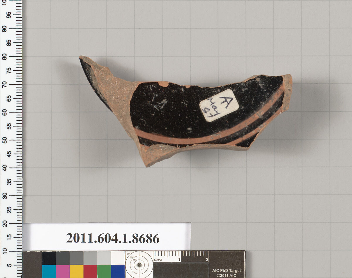Terracotta fragment of a stemless kylix (drinking cup), Terracotta, Greek, Attic 