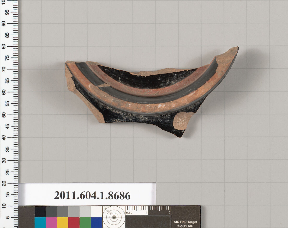 Terracotta fragment of a stemless kylix (drinking cup), Terracotta, Greek, Attic