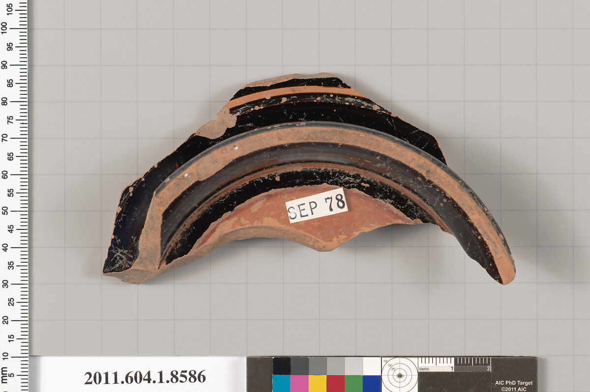 Terracotta fragment of a stemless kylix (drinking cup), Attributed to the Carlsruhe Painter [DvB], Terracotta, Greek, Attic