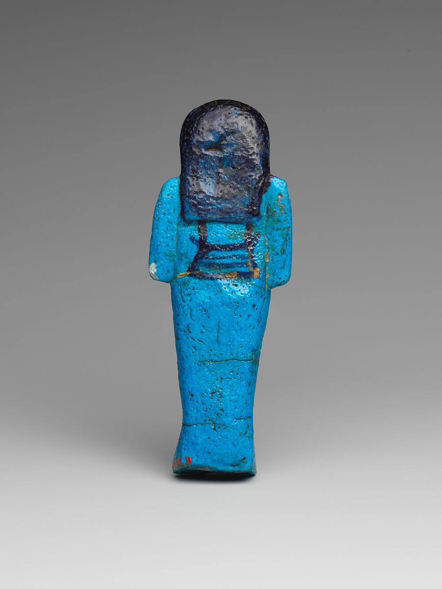 Shabti of the Adoratrice of Hathor Henettawy, wife of Painedjem I, Faience