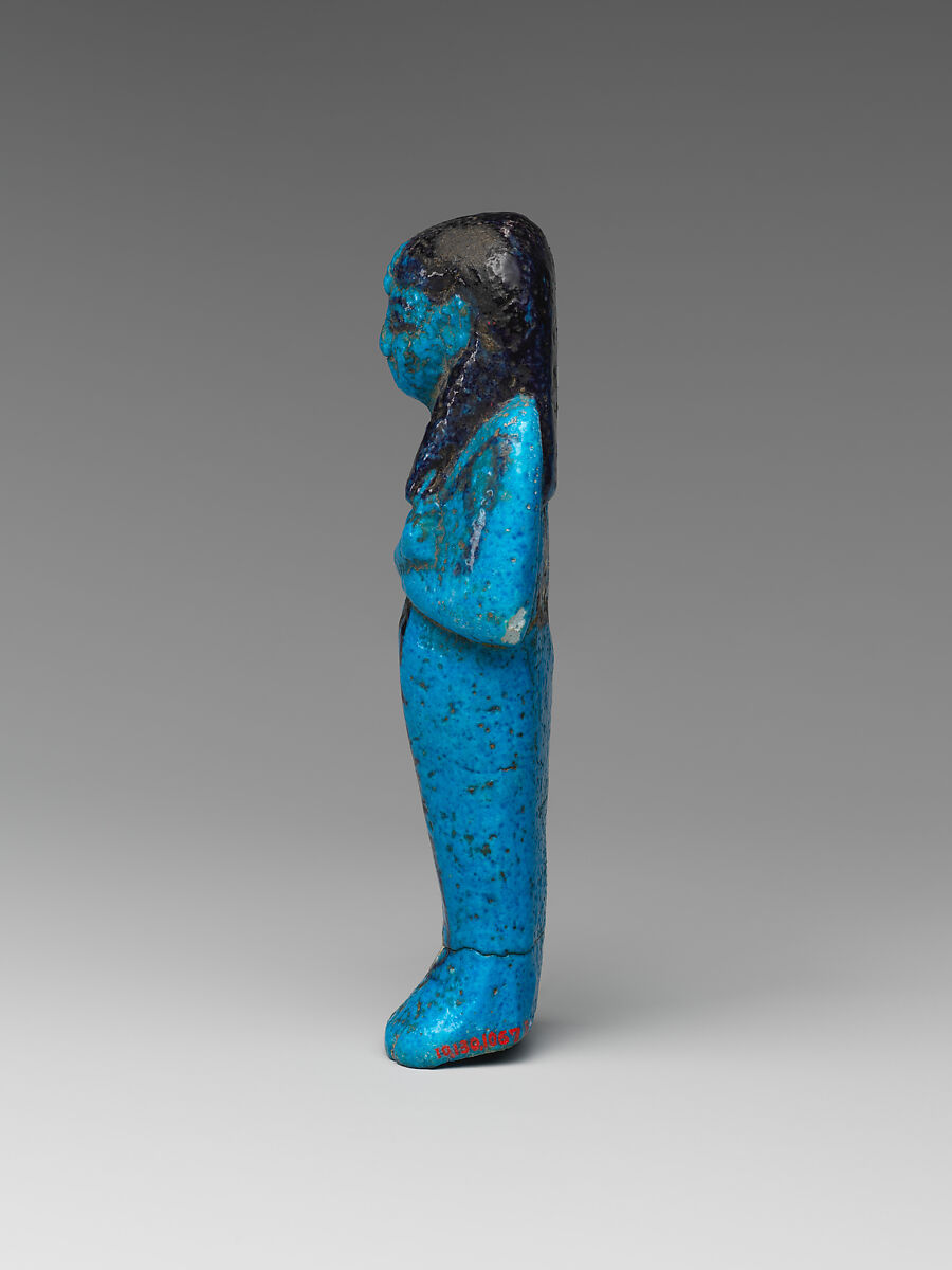 Shabti of the Adoratrice of Hathor Henettawy, wife of Painedjem I, Faience