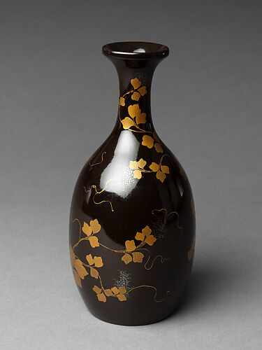 Sake bottle with grapevine decoration