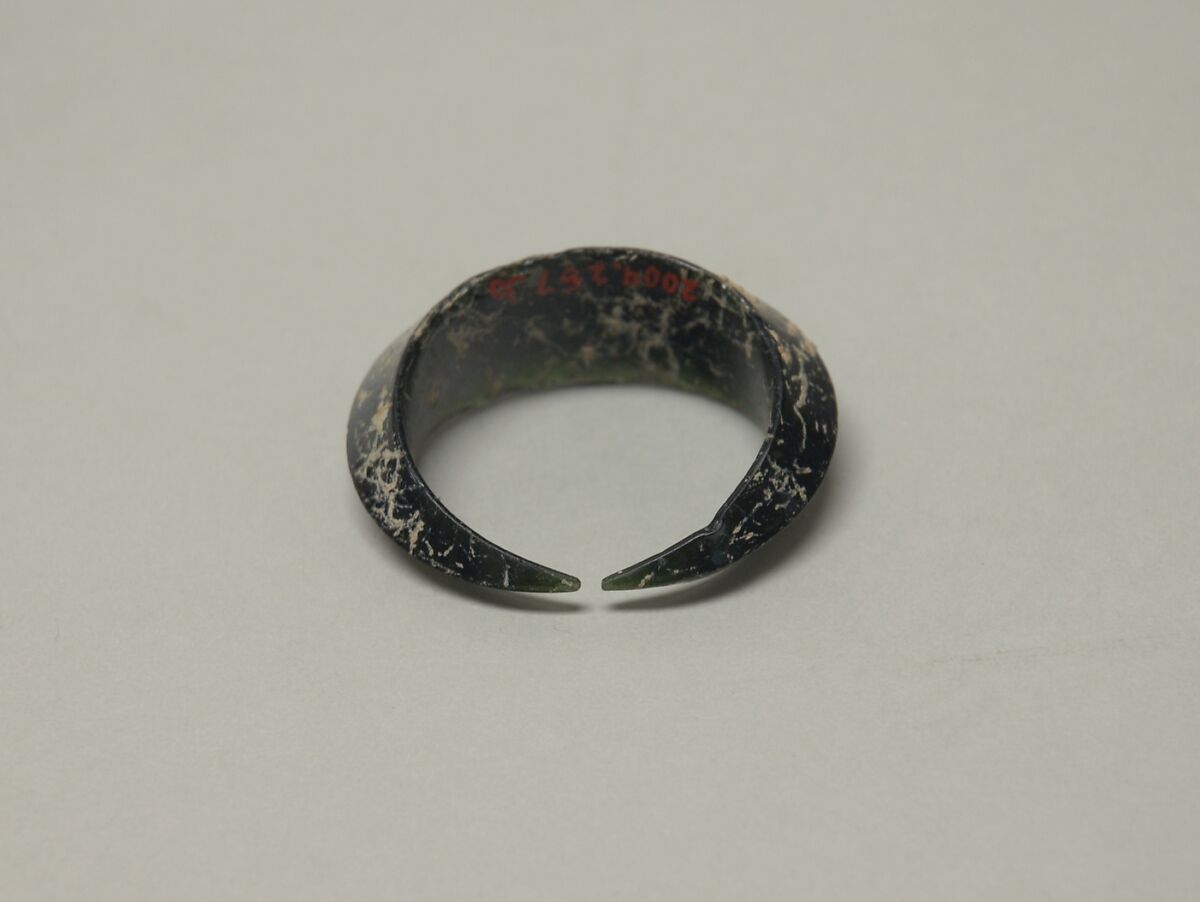 Pair of Closed Crescent-Shaped Earrings, Dark green glass, Vietnam