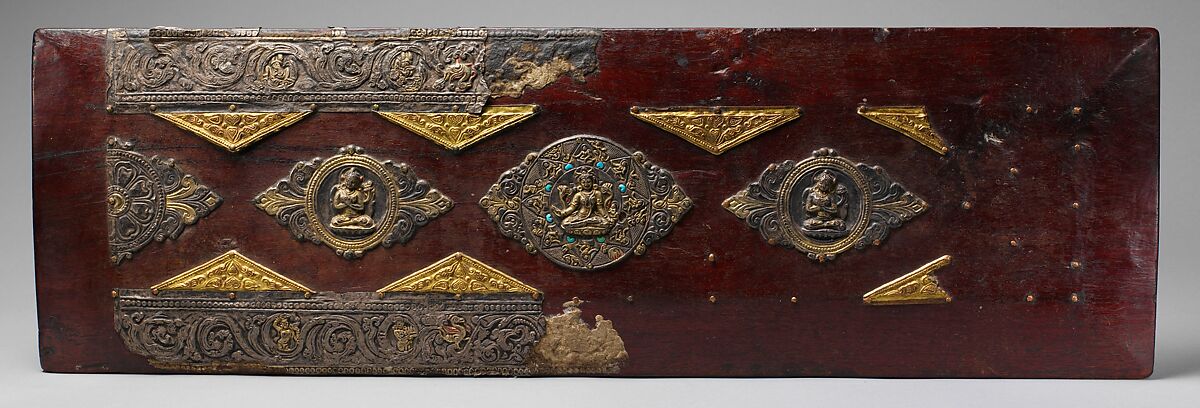 Pair of Book Covers for a Buddhist Text, Wood with traces of paint; decorative mounts of silver with gilt semiprecious stones, and gilt-copper alloy, North India and Tibet