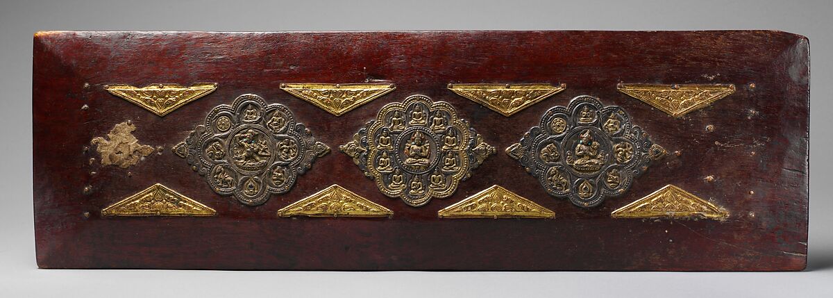 Pair of Book Covers for a Buddhist Text, Wood with traces of paint; decorative mounts of silver with gilt semiprecious stones, and gilt-copper alloy, North India and Tibet