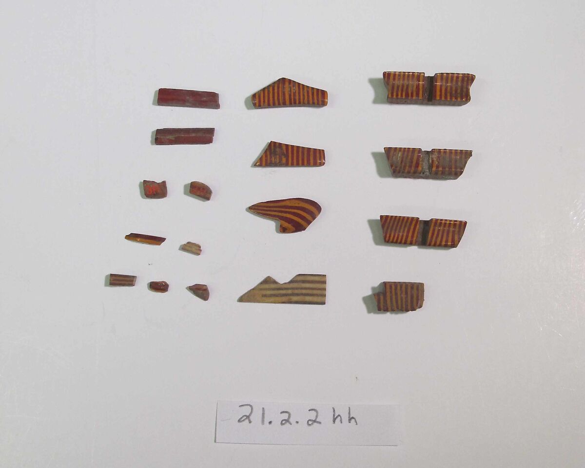 Inlays from shrine: box of striped bars, Glass