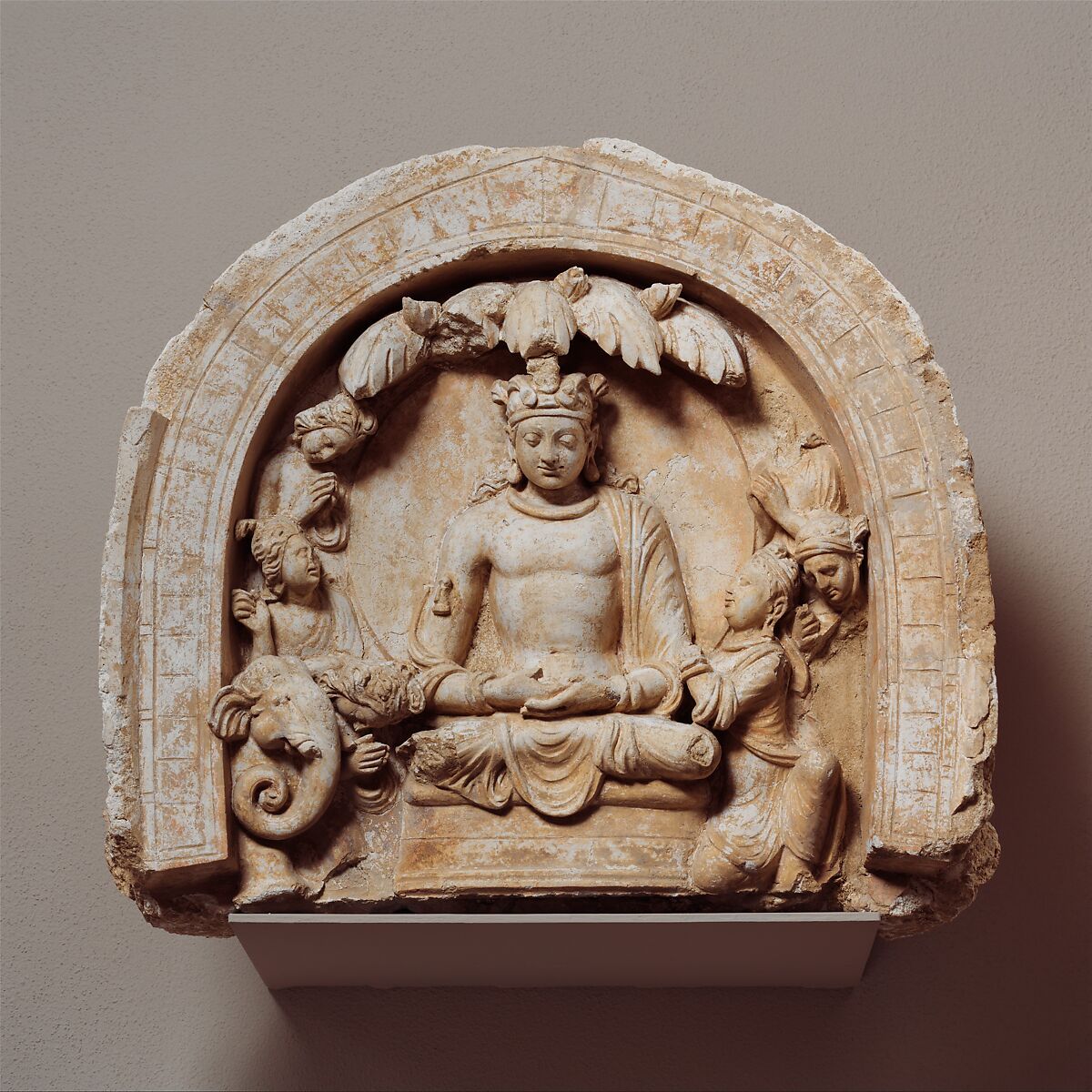 Niche with the Seated Bodhisattva Shakyamuni Flanked by Devotees and an Elephant, Stucco, Afghanistan (Hadda) 