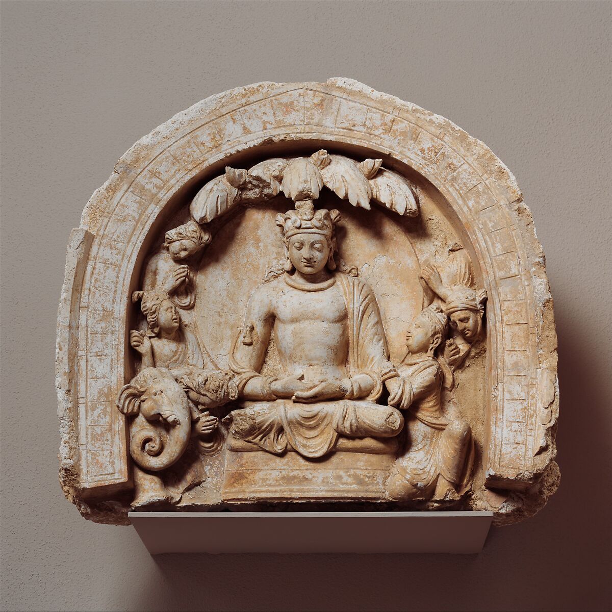 Niche with the Seated Bodhisattva Shakyamuni Flanked by Devotees and an Elephant, Stucco, Afghanistan (Hadda)