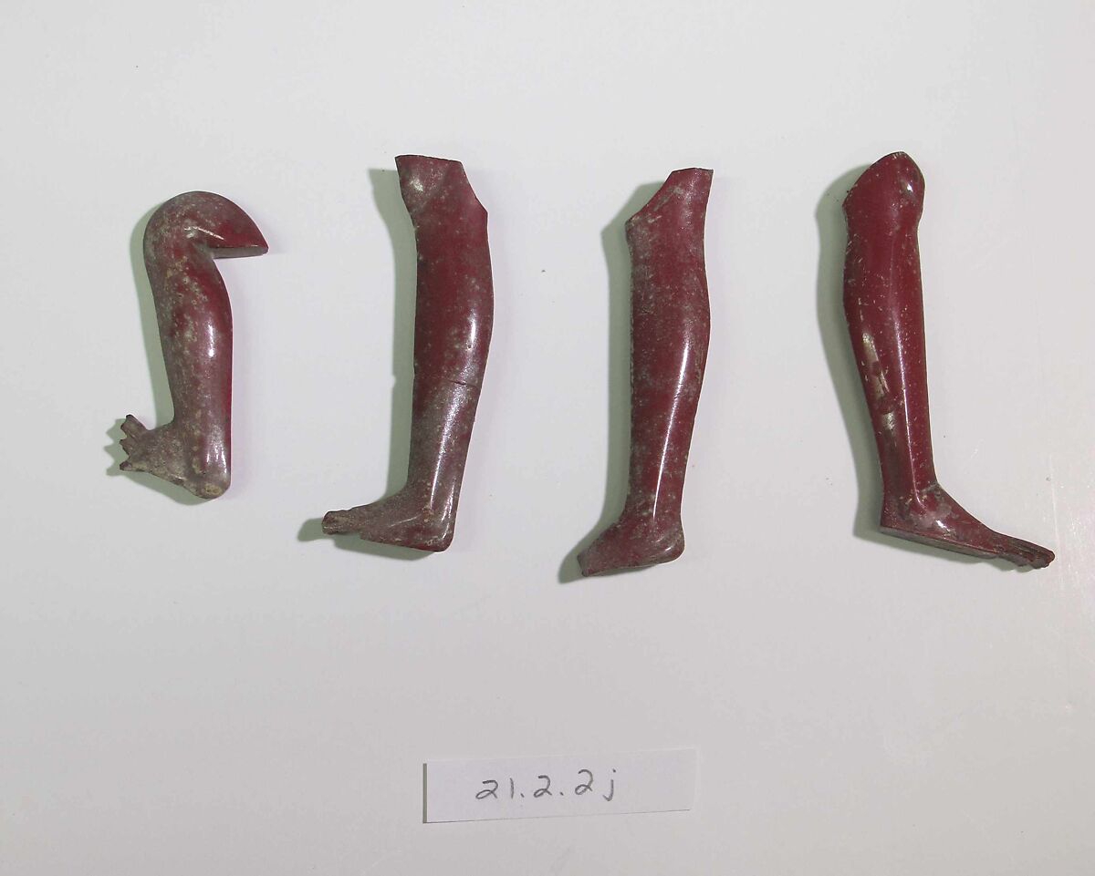 Inlays from shrine: two legs and box of fragments, Glass
